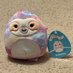 Squishmallows colorful sloth whose name is Adderley